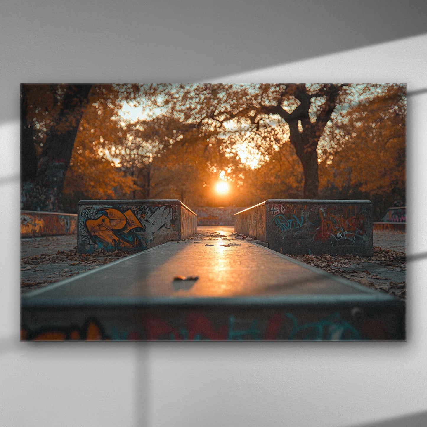 Autumn sunset in a park with graffiti, capturing warm hues and a tranquil atmosphere.