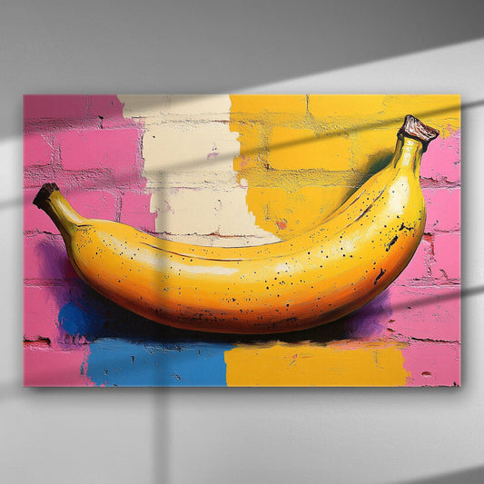 Colorful banana on a vibrant pink, yellow, and blue background wall canvas art.