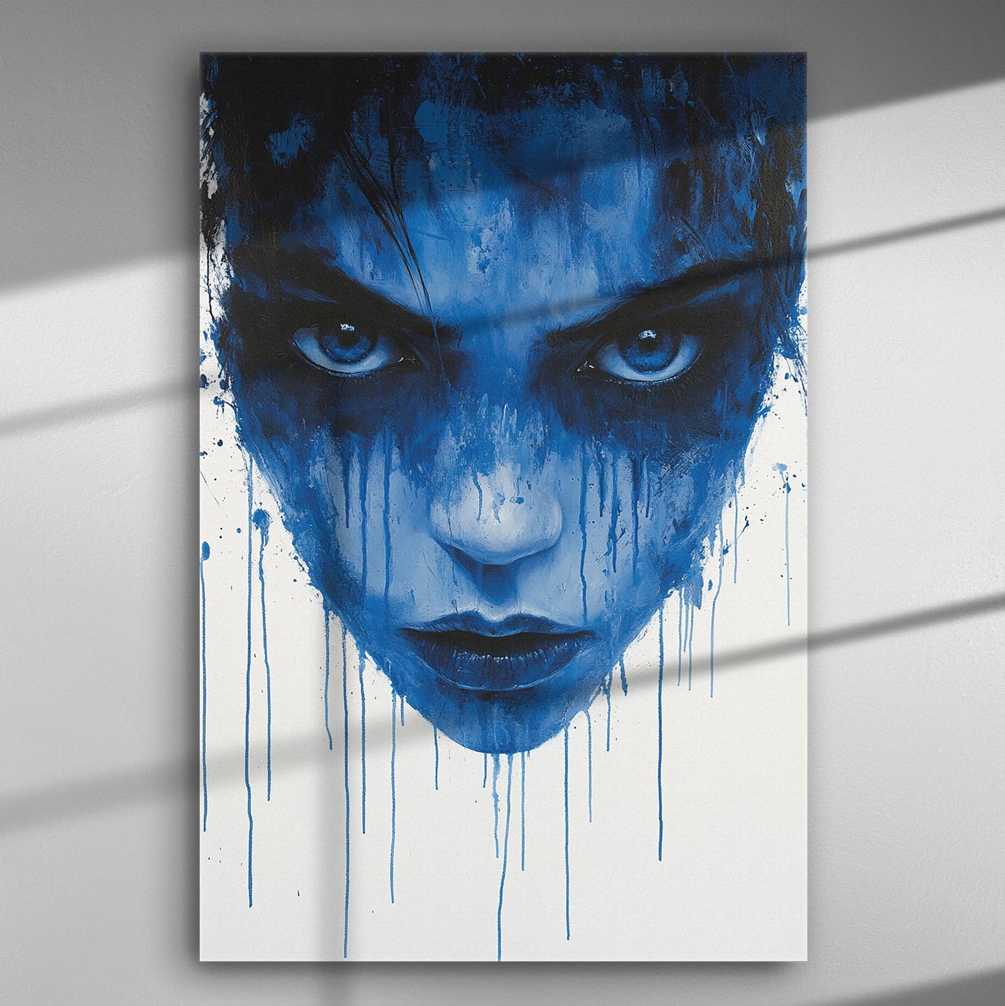 Abstract blue face with dripping paint on a canvas.