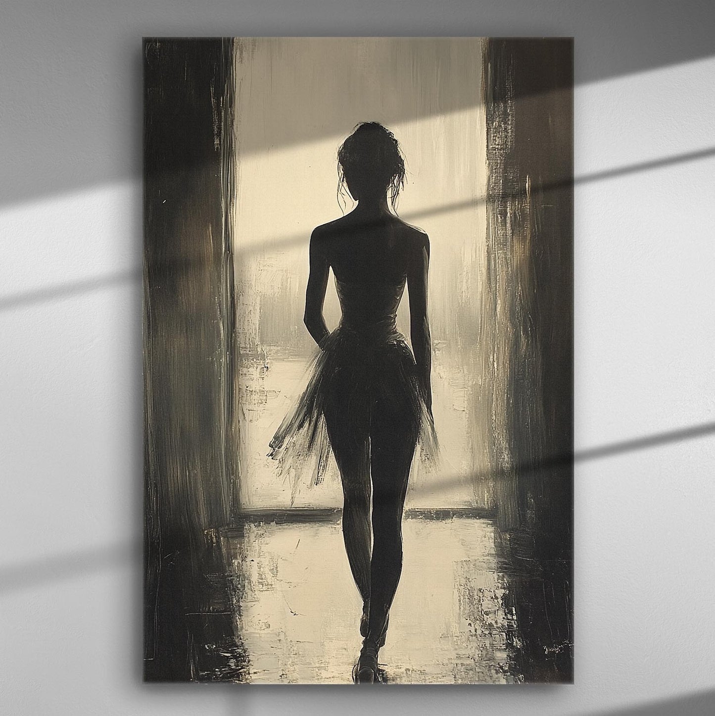 Silhouette of a ballerina in black and white, captured in a light-filled scene.