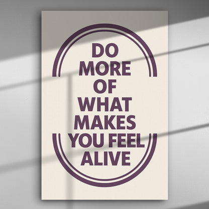 Inspirational quote canvas print reading 'Do more of what makes you feel alive' with bold typography on a light background.