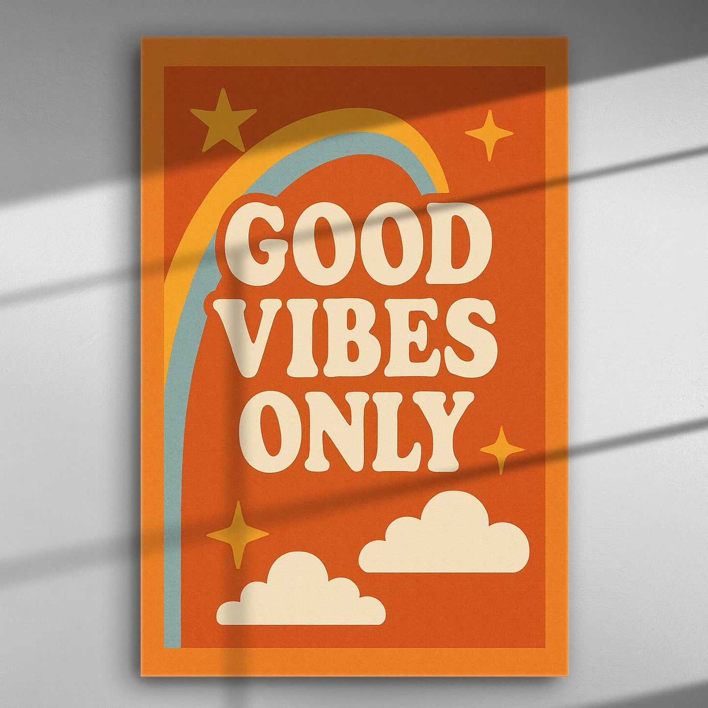 Colorful canvas print with the phrase 'Good Vibes Only' surrounded by stars and clouds.