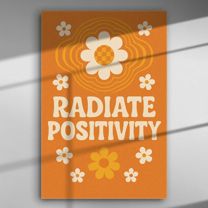 Canvas with text 'Radiate Positivity', orange background, white and orange flowers.
