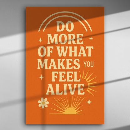 Vibrant orange canvas print with motivational text 'Do More of What Makes You Feel Alive'