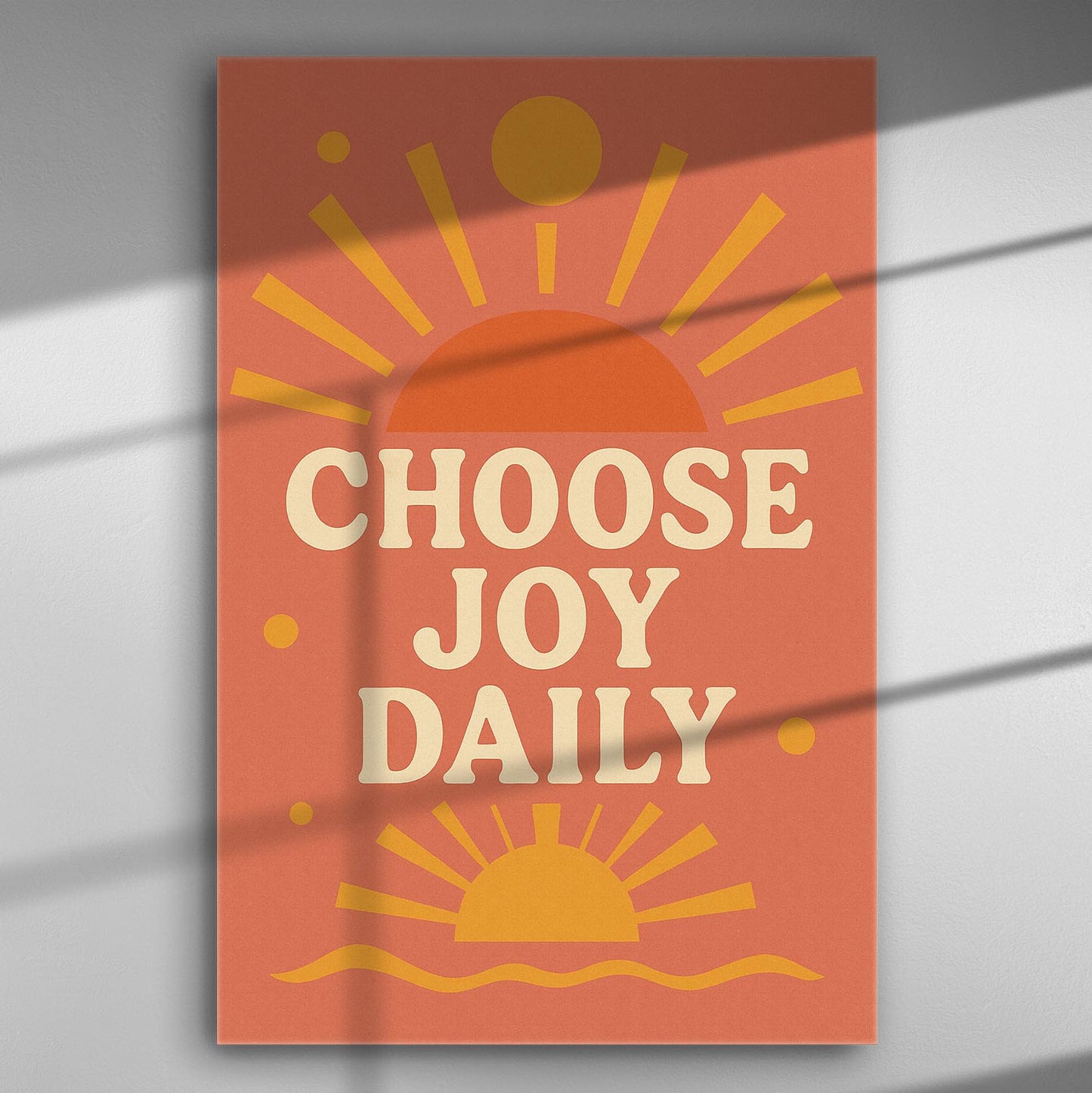 Canvas print with the text 'Choose Joy Daily' in orange and yellow, featuring sunburst graphics.