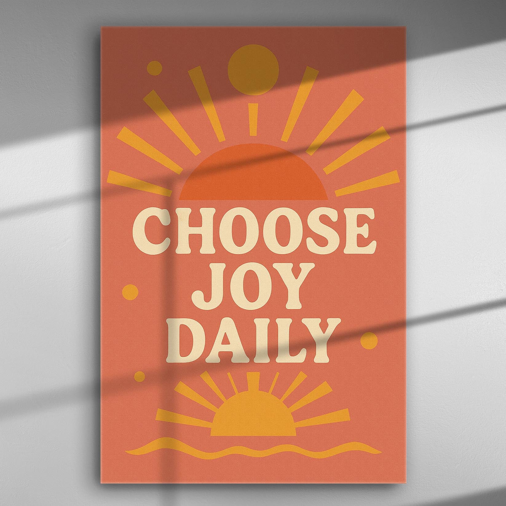 Canvas print with the text 'Choose Joy Daily' in orange and yellow, featuring sunburst graphics.