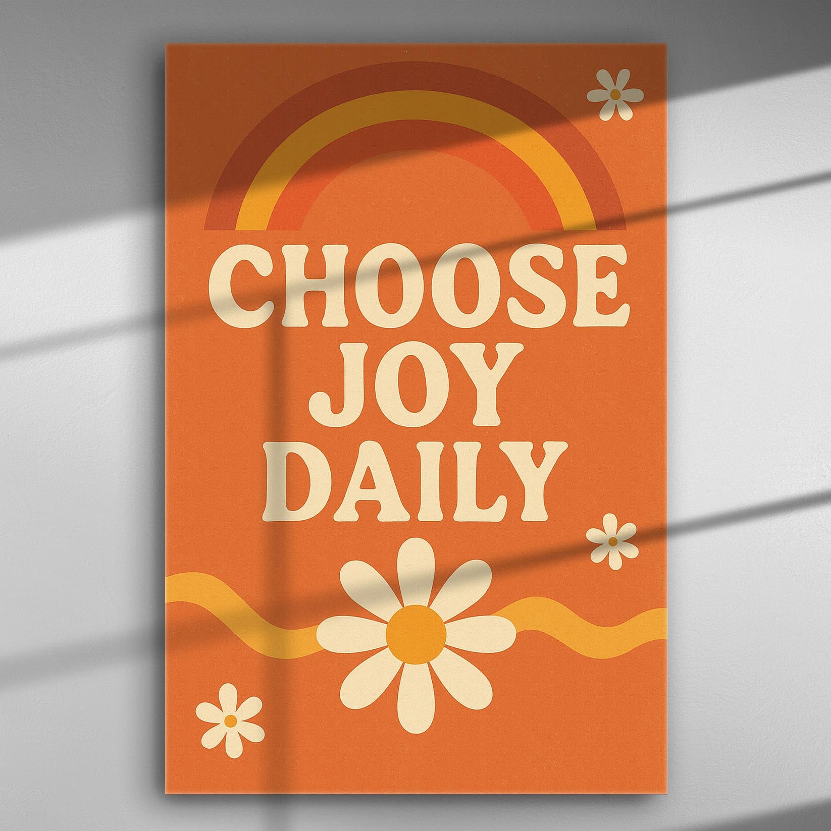 Orange canvas with phrase 'Choose Joy Daily' in white letters, featuring a rainbow and daisies.