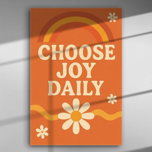 Orange canvas with phrase 'Choose Joy Daily' in white letters, featuring a rainbow and daisies.