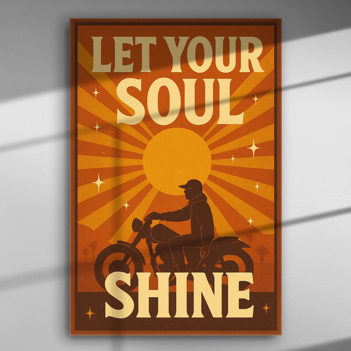 Retro-style poster with a motorcycle silhouette and the text 'Let Your Soul Shine' in bold letters against an orange sunburst background.