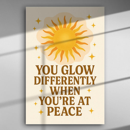 Canvas print with sun illustration and the text 'You glow differently when you're at peace'.
