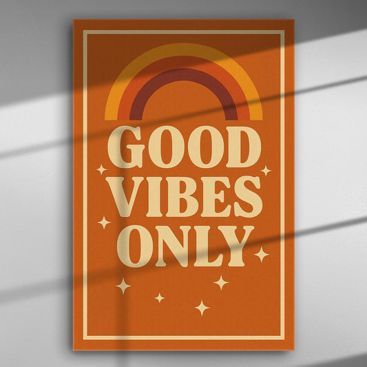 A canvas print with the text 'Good Vibes Only' and rainbow design in warm orange color.