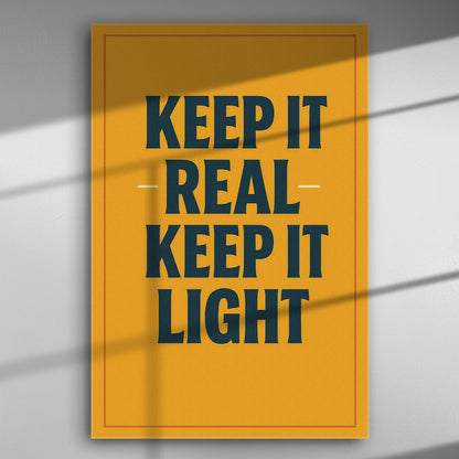 Canvas print with the text 'Keep it real, keep it light' in bold black letters on an orange background.