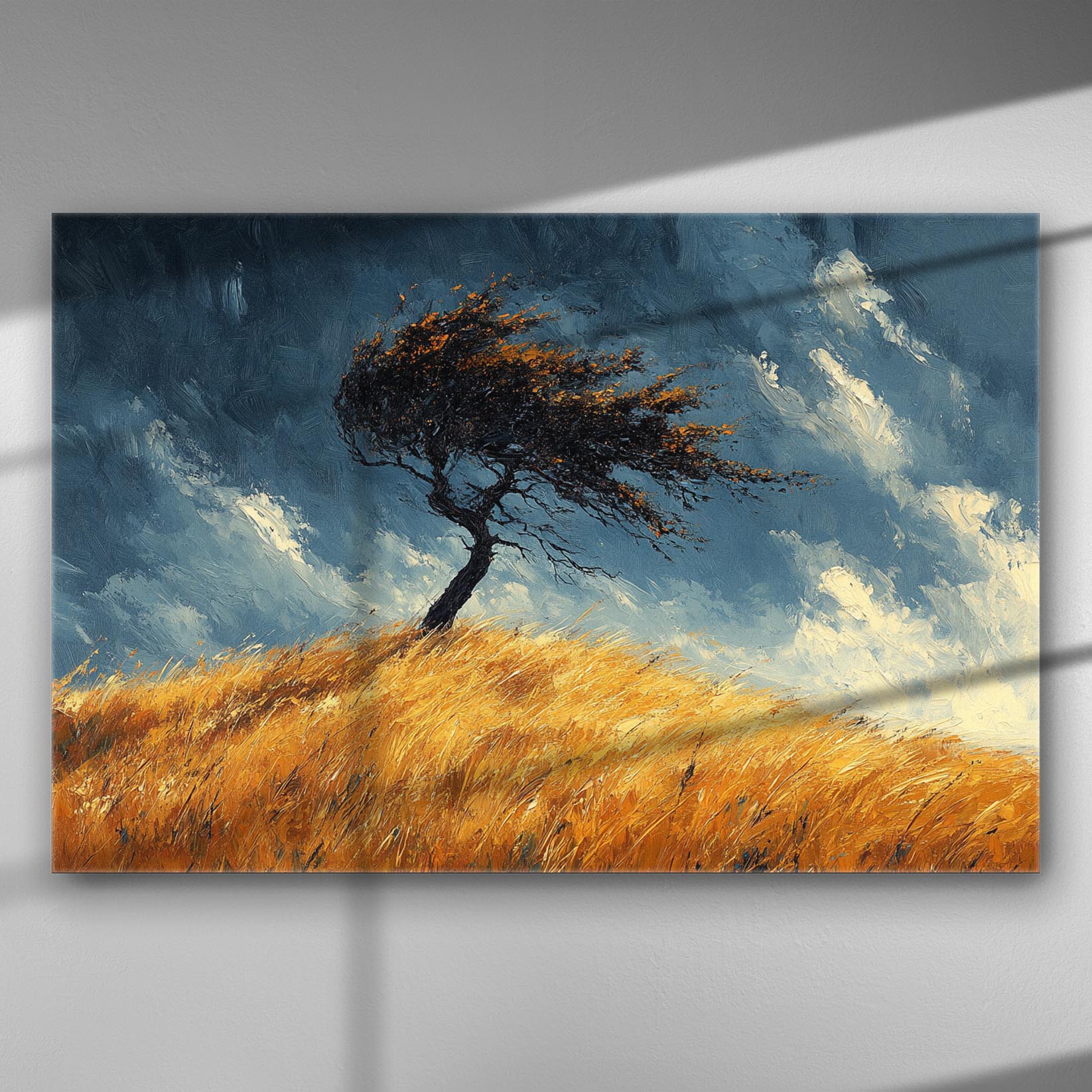 A lone tree bending in the wind on a golden hill under a blue sky with clouds.