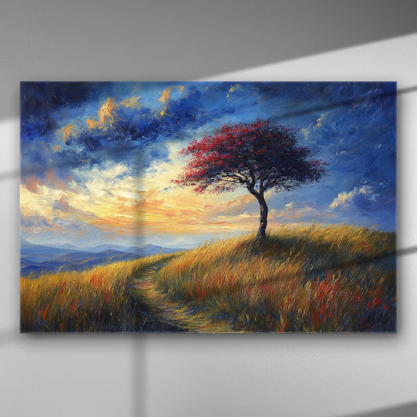 Lonely tree on a hill at sunset with vibrant sky and grassland.