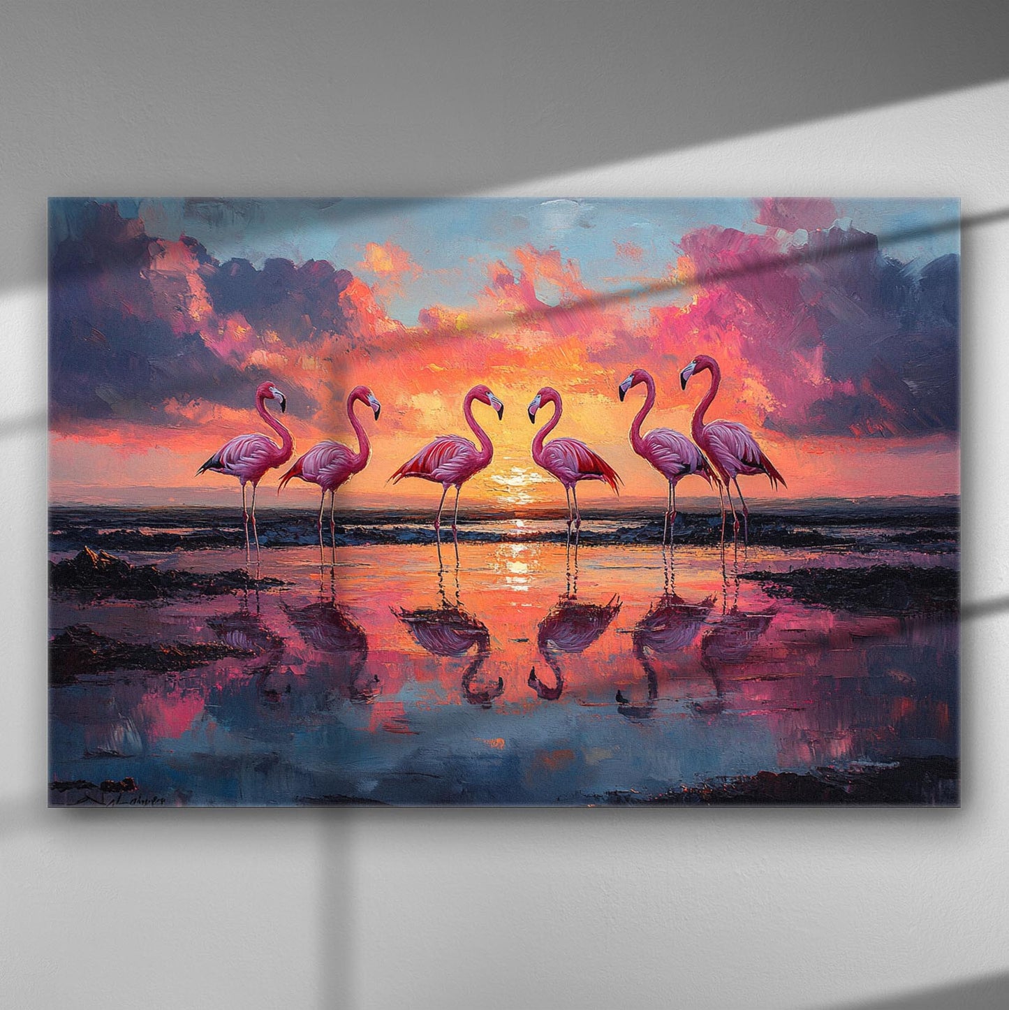 Pink flamingos standing in water during a vivid sunset on canvas print.