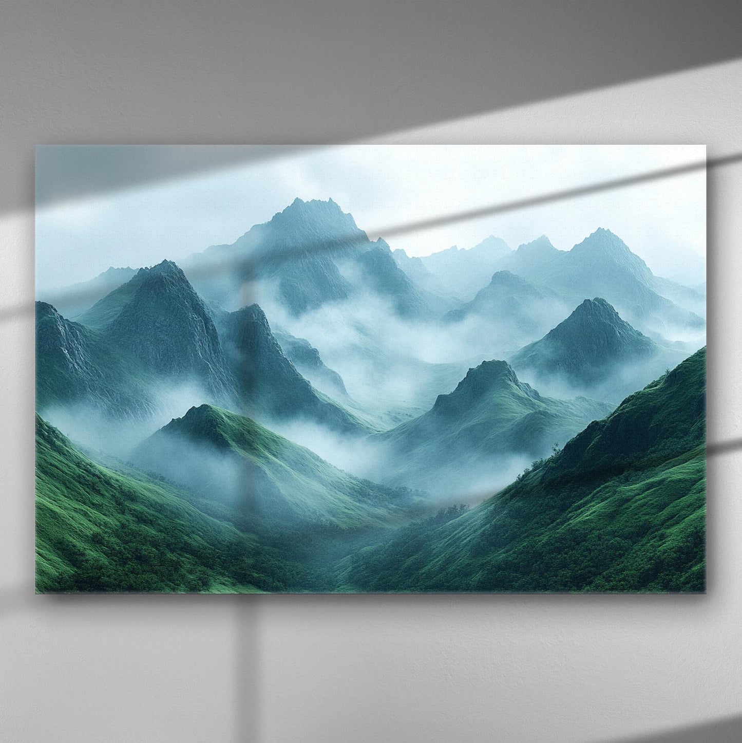 Canvas art print of a misty mountain range with green hills.