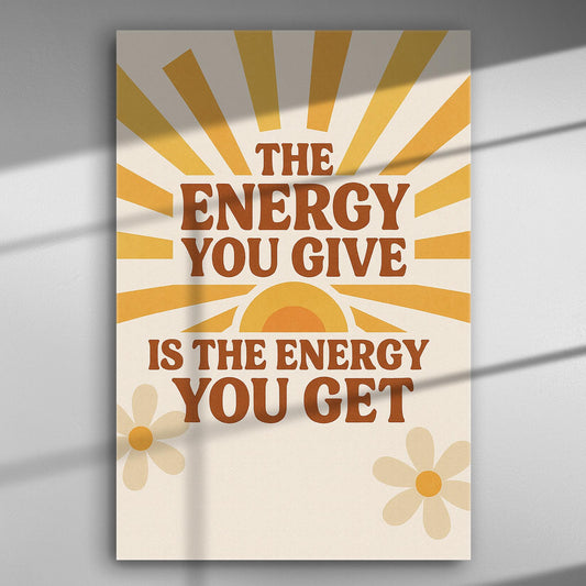 Canvas with motivational quote 'The energy you give is the energy you get' in warm colors with sun rays and flowers.