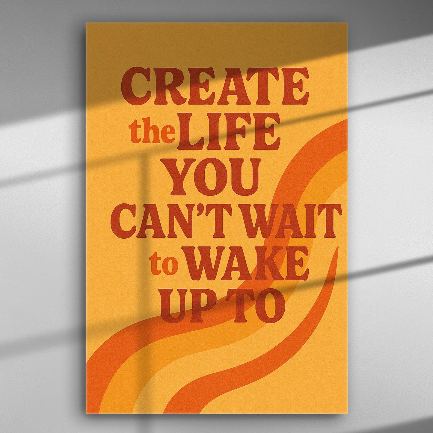 Motivational canvas with the quote 'Create the Life You Can't Wait to Wake Up To' in orange and red on yellow background.