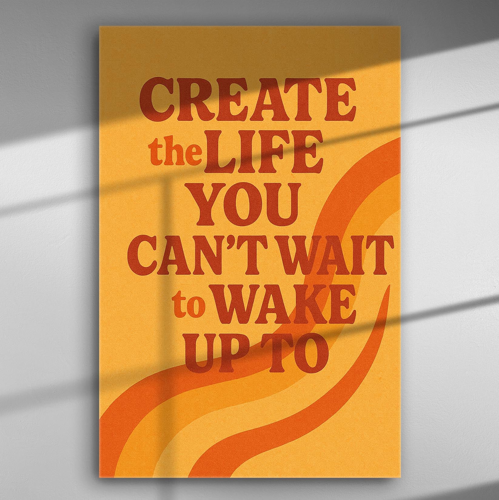 Motivational canvas with the quote 'Create the Life You Can't Wait to Wake Up To' in orange and red on yellow background.