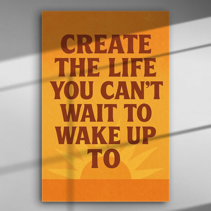 Inspirational quote canvas with 'Create the life you can't wait to wake up to' in bold typography on an orange background.