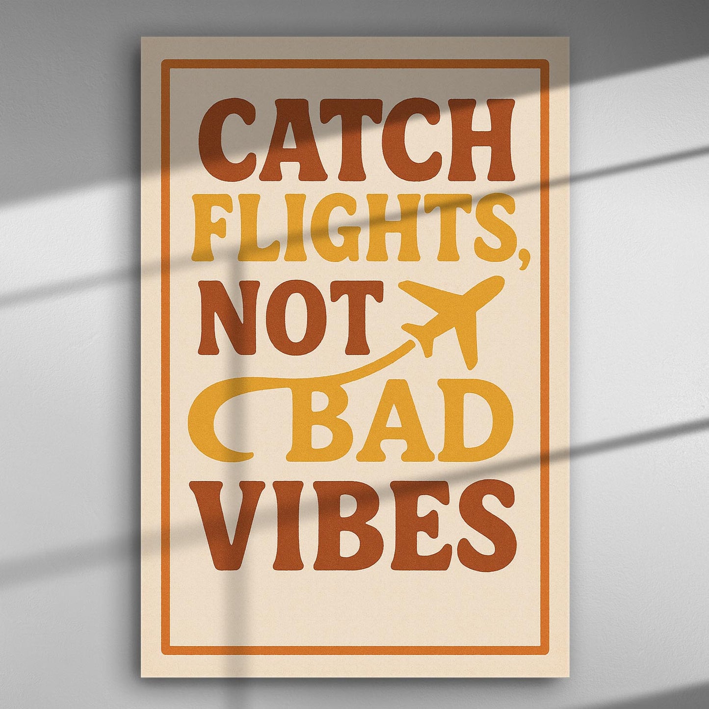 Decorative canvas with the text 'Catch Flights, Not Bad Vibes' in warm colors.