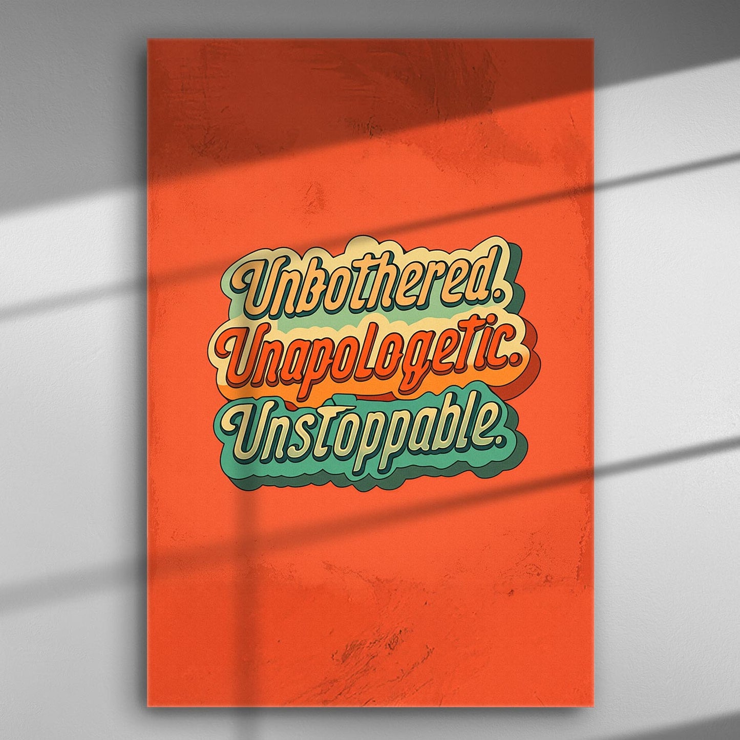 Canvas print with the words 'Unbothered. Unapologetic. Unstoppable.' in retro typography on an orange background.
