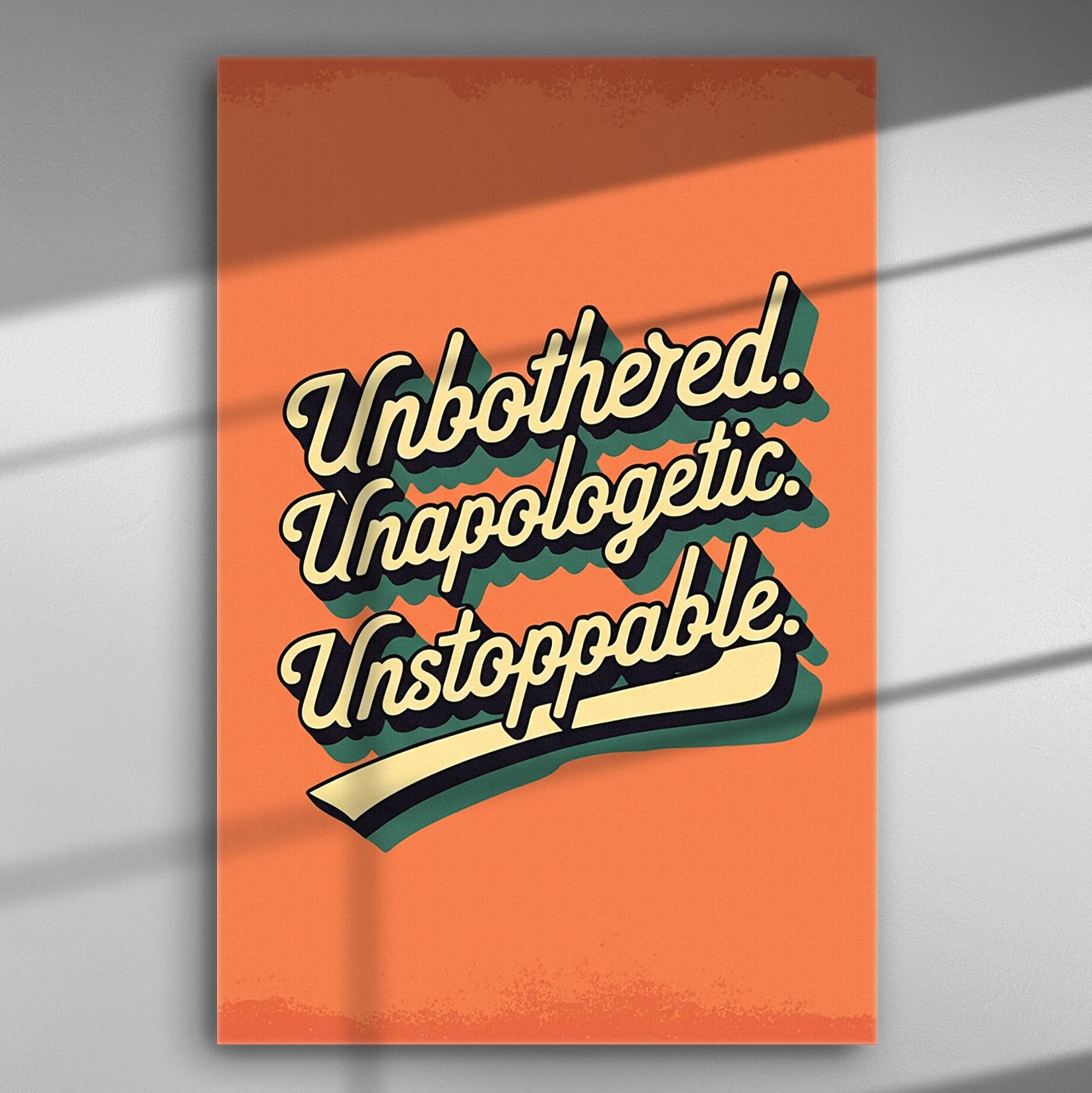 Motivational typography art canvas with the words 'Unbothered. Unapologetic. Unstoppable.' on an orange background.