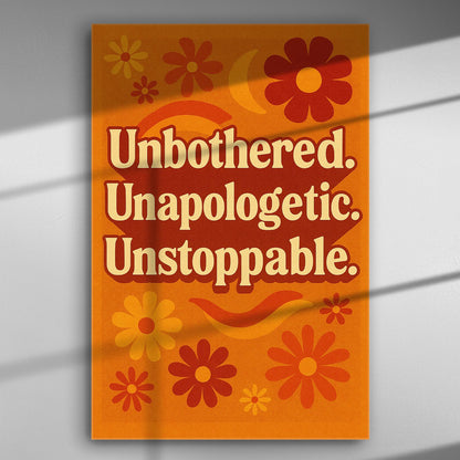 Canvas with bold text 'Unbothered. Unapologetic. Unstoppable.' and colorful flowers on an orange background.