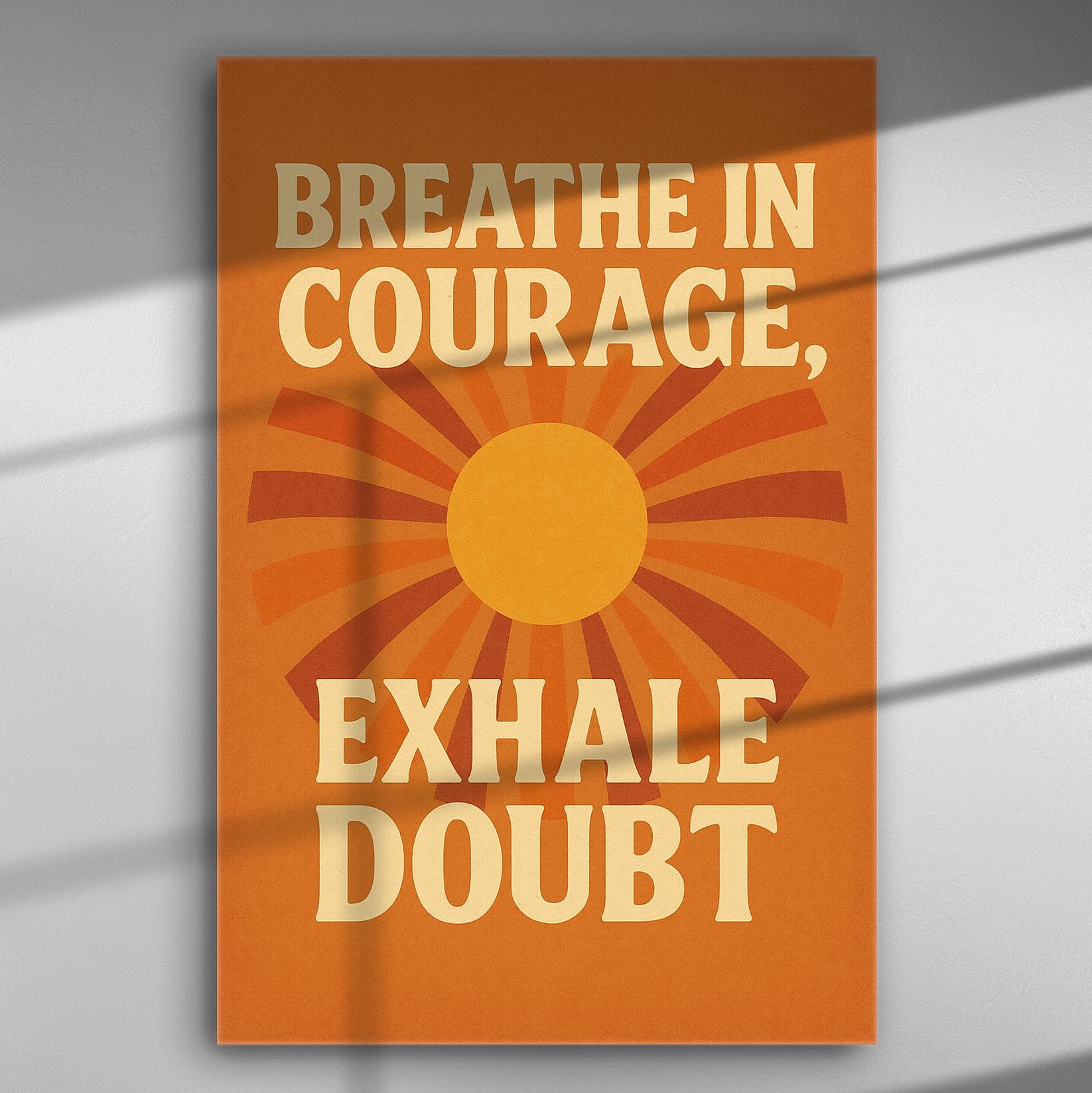 Canvas print with motivational quote 'Breathe in Courage, Exhale Doubt' with orange and yellow sunburst design.