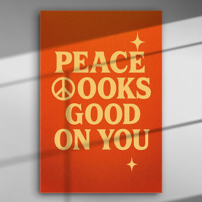 Orange canvas with the phrase 'Peace Looks Good on You' in bold letters
