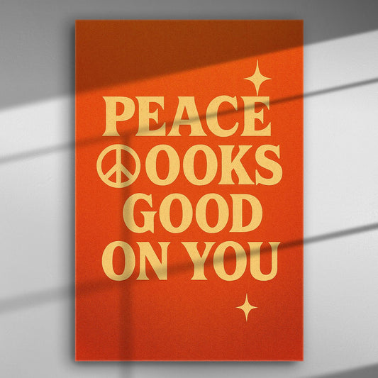 Orange canvas with the phrase 'Peace Looks Good on You' in bold letters