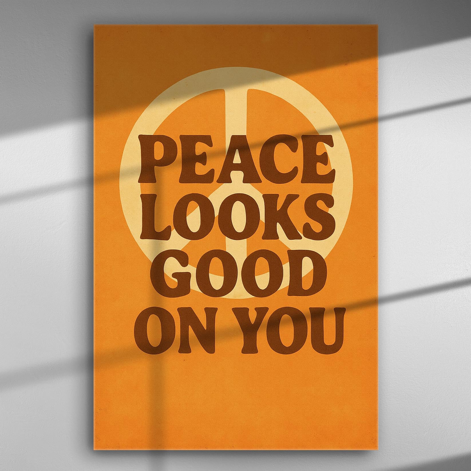 Canvas print with the text 'Peace Looks Good On You' in bold typography and a peace symbol in the background.