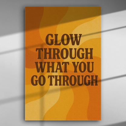 Inspirational canvas with the quote "Glow Through What You Go Through" in orange and yellow tones.