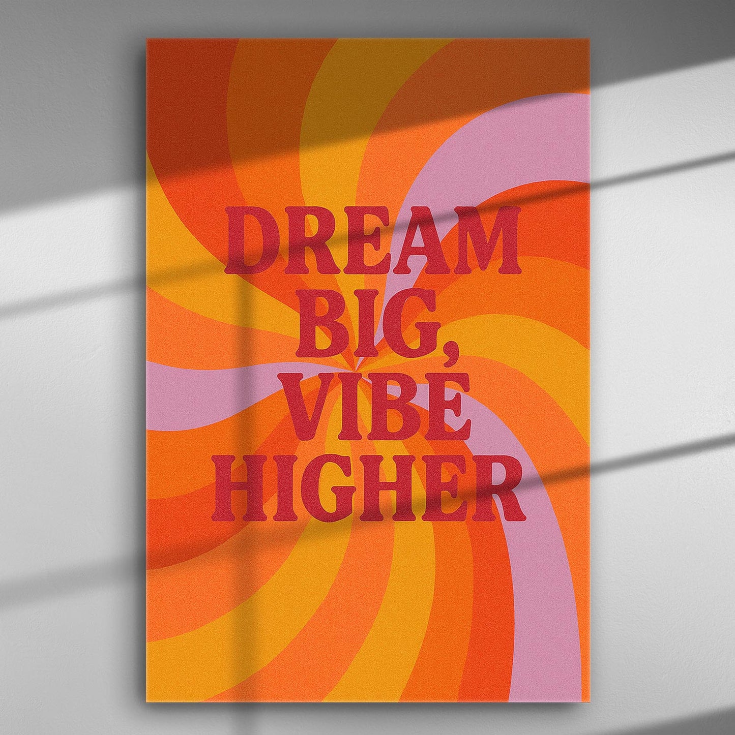 Colorful canvas print with the phrase 'Dream Big, Vibe Higher' in bold letters.