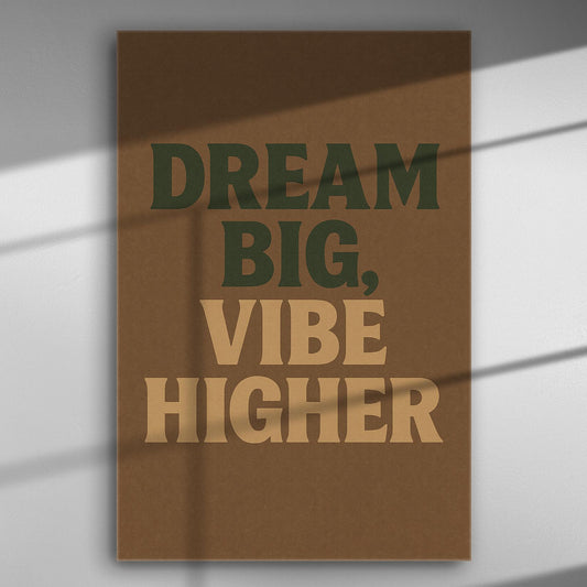 Motivational phrase "Dream Big, Vibe Higher" in bold typography on a brown background canvas.