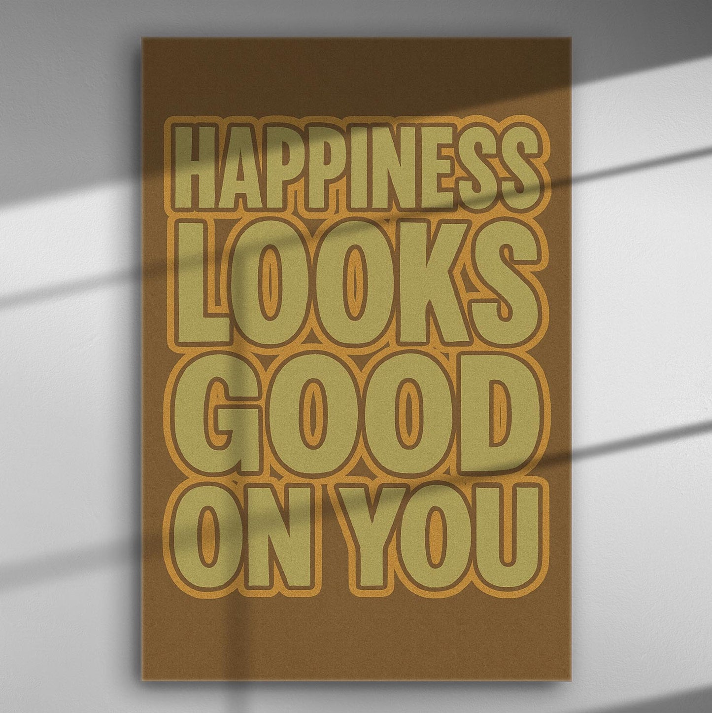 Canvas print with the text 'Happiness Looks Good On You' in warm colors.