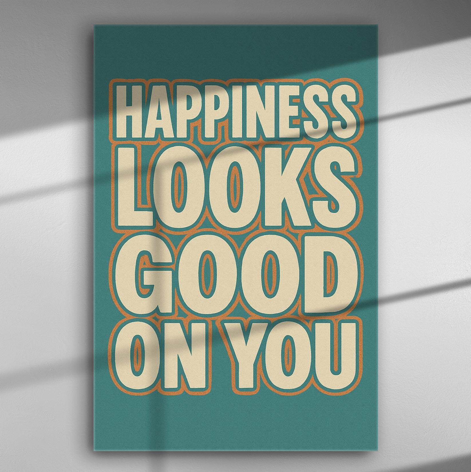 Canvas print with the phrase 'Happiness Looks Good On You' in bold letters on a colorful background.