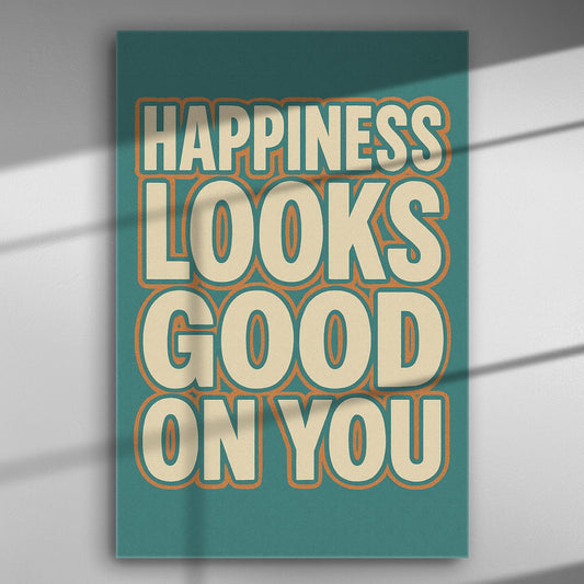 Canvas print with the phrase 'Happiness Looks Good On You' in bold letters on a colorful background.