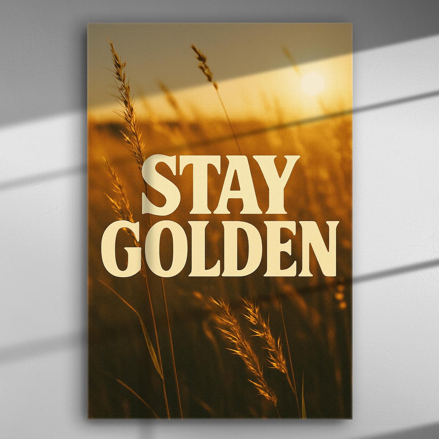 Canvas print with the words 'STAY GOLDEN' over a golden sunset with wheat.