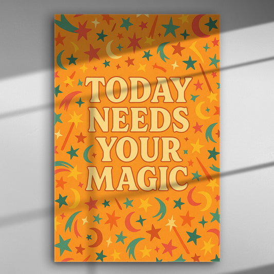 Motivational canvas print with 'Today Needs Your Magic' in playful font, surrounded by colorful stars and moons on an orange background.