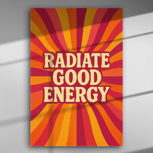 Abstract canvas print with the text 'Radiate Good Energy' on a vibrant orange and red background.