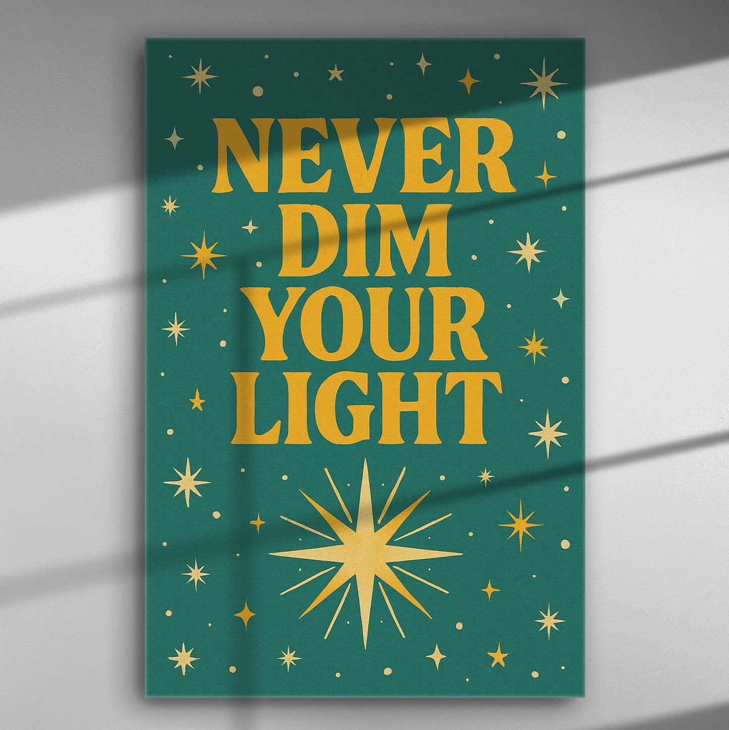 Canvas print with the words 'Never Dim Your Light' on a green background with gold stars.