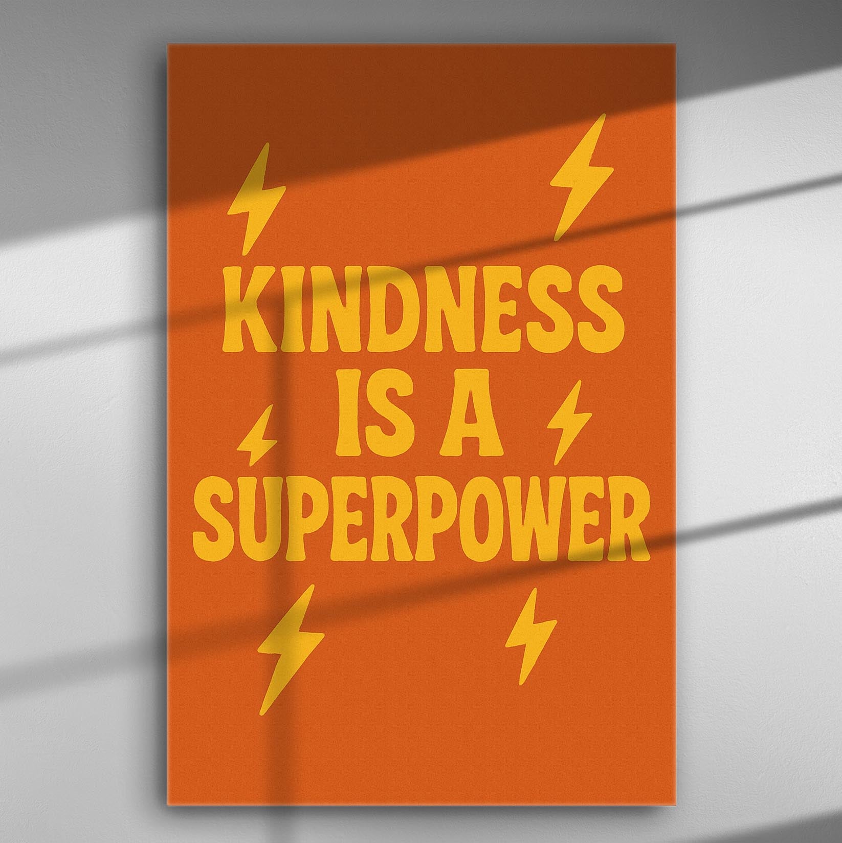 Orange canvas print with the phrase 'Kindness is a Superpower' in bold yellow letters and lightning designs.