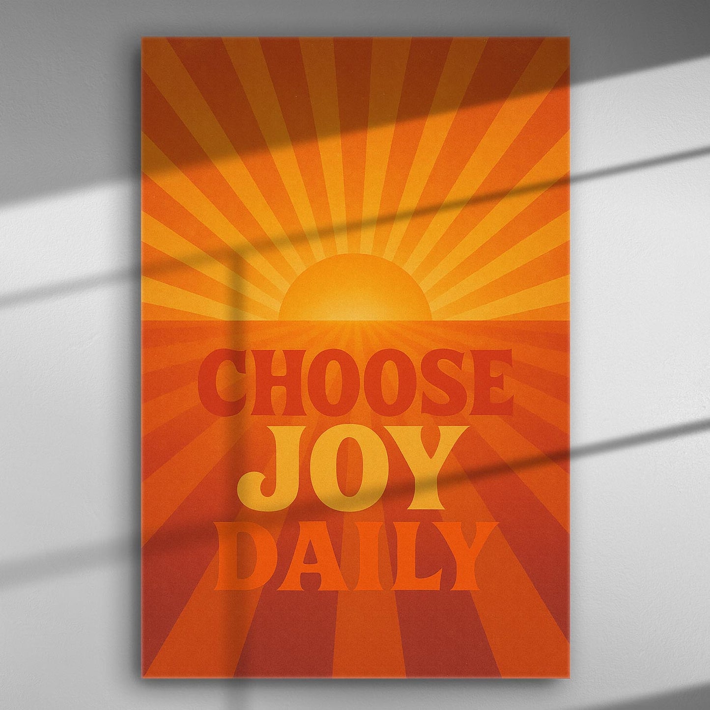 Motivational canvas print with a sunburst and the phrase 'Choose Joy Daily' in orange and yellow hues.