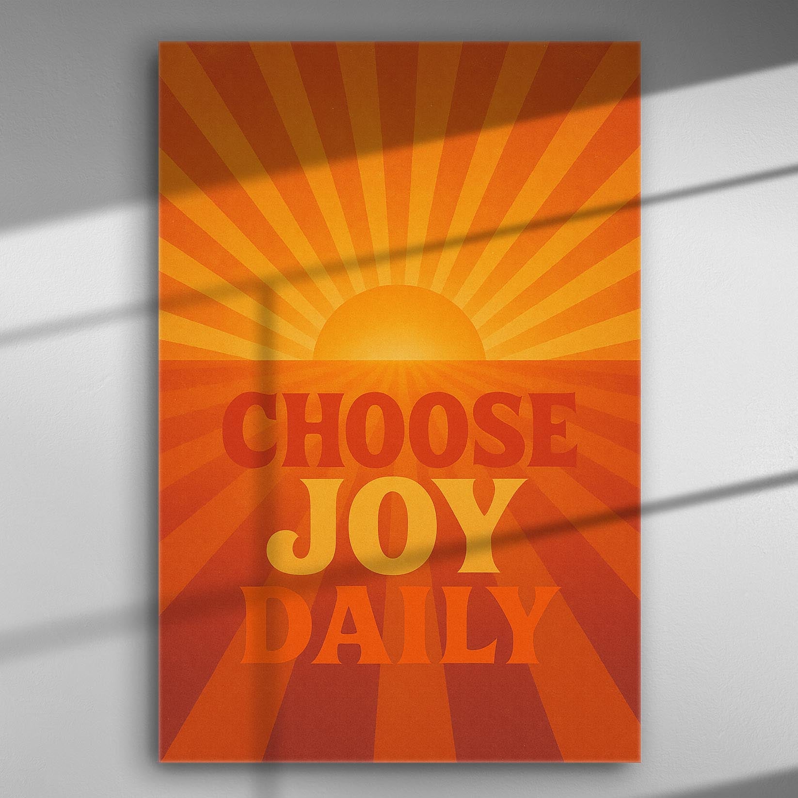 Motivational canvas print with a sunburst and the phrase 'Choose Joy Daily' in orange and yellow hues.