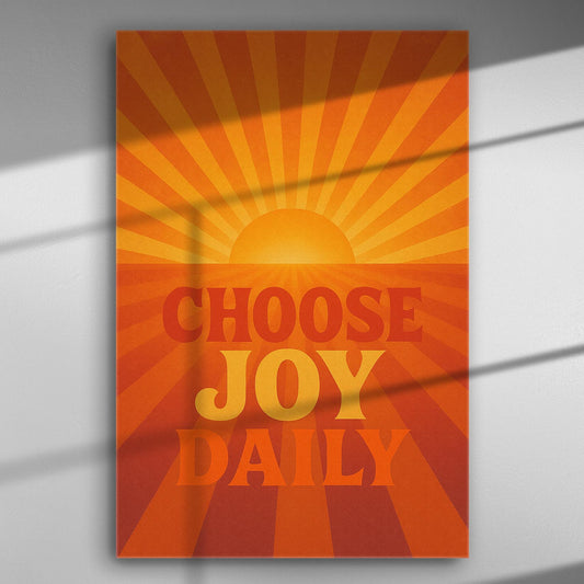 Motivational canvas print with a sunburst and the phrase 'Choose Joy Daily' in orange and yellow hues.
