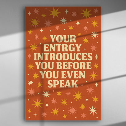 Canvas print with the quote 'Your energy introduces you before you even speak' on an orange background with stars.