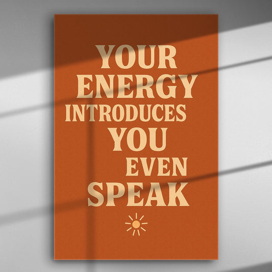 Motivational canvas with the text 'Your Energy Introduces You Even Before You Speak' in orange background.