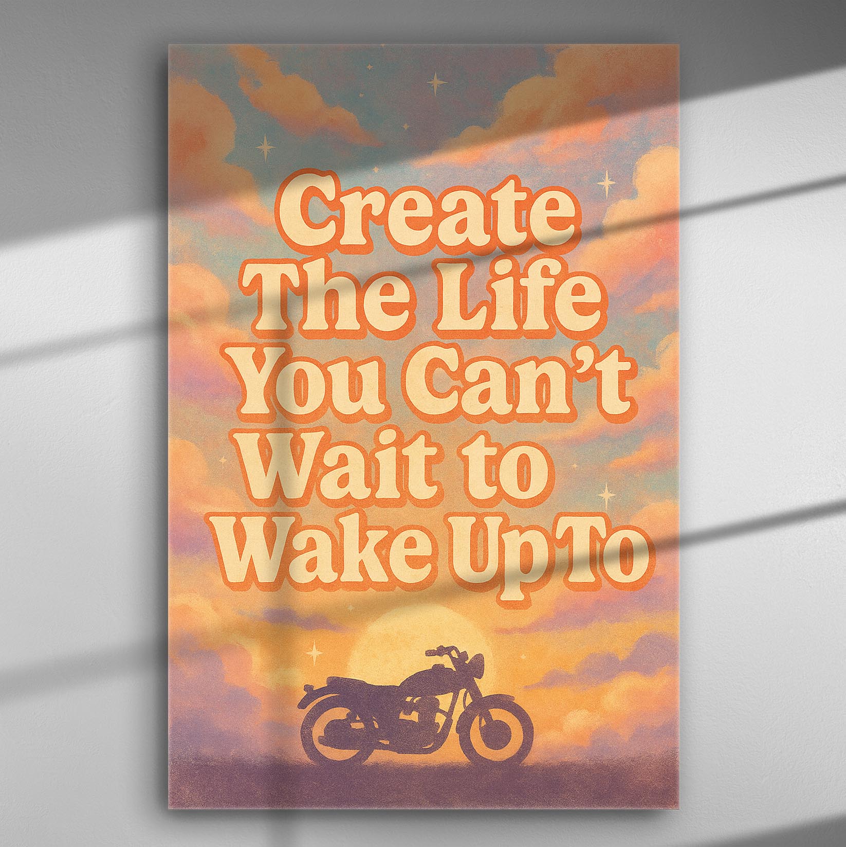 A motivational canvas print with the text 'Create The Life You Can't Wait to Wake Up To' and an image of a motorcycle under a colorful sky.