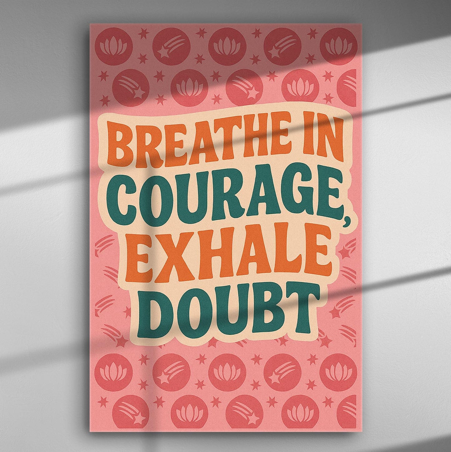 Text on canvas with the words 'Breathe in Courage, Exhale Doubt' on a pink background with patterns.